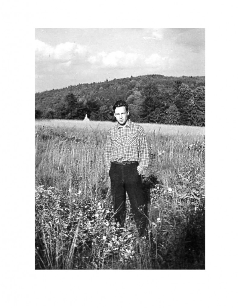 young man standing in a field