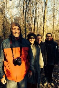 Family posing in the woods