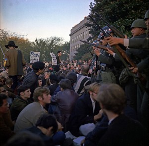 people protesting the Vietnam war with soldiers standing in front of them
