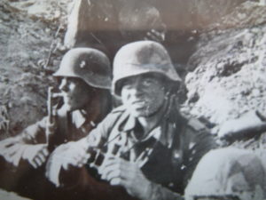two men in German uniform in dugout