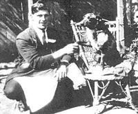 black and white photo of man with an old dog