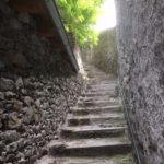 ascending stairs and stone walls