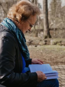 woman reading outdoors