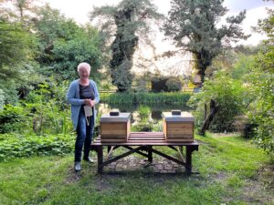 woman with two bee hives