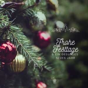 Festtagsgruesse mit Weihnachtskugeln